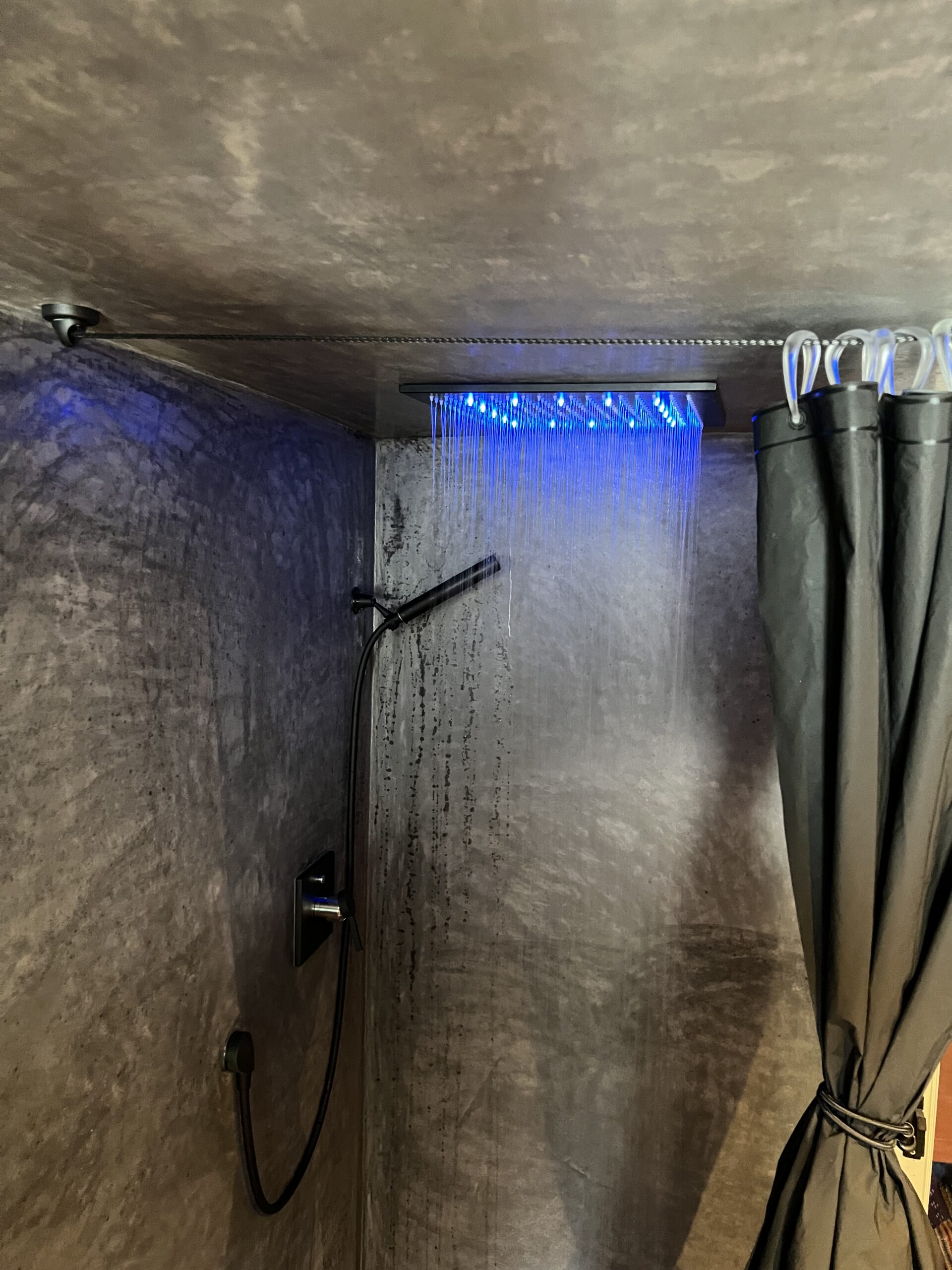 Blue-themed shower in The Loft apartment, Arbaz